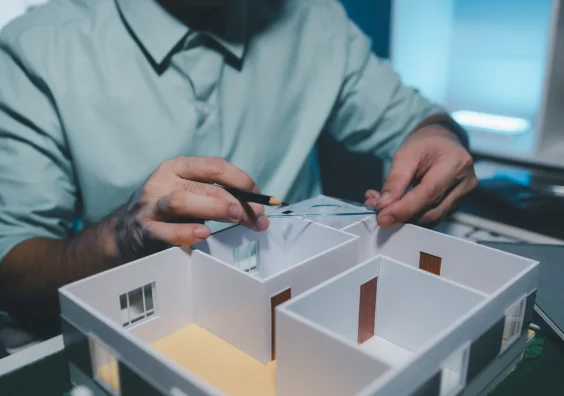 architect-is-working-office-engineer-works-house-model-desk-he-used-his-expertise-skill-creativity-design-best-work-client